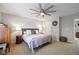 Bedroom featuring a comfortable bed, neutral tones, and a ceiling fan at 317 Virginia St, Fortville, IN 46040
