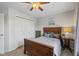 Comfortable bedroom with wood furniture, providing a cozy retreat, complemented by carpet and neutral walls at 317 Virginia St, Fortville, IN 46040