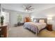 Comfortable bedroom with neutral tones, a ceiling fan, and natural light at 317 Virginia St, Fortville, IN 46040