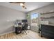 Efficient home office featuring natural light, desk space and storage, perfect for focused work or study sessions at 317 Virginia St, Fortville, IN 46040