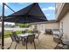 Grilling and outdoor dining area on the patio with ample seating at 317 Virginia St, Fortville, IN 46040