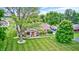 Aerial view of a home with a large yard, mature trees, and RV parking at 333 N Windswept Rd, Greenfield, IN 46140