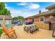 Inviting backyard showcasing a wooden deck with outdoor seating, an outdoor kitchen, and a metal stock tank pool at 333 N Windswept Rd, Greenfield, IN 46140