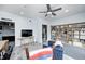 Open bonus room with unique floors, flat screen television and built in shelving with lots of decor at 333 N Windswept Rd, Greenfield, IN 46140