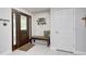 Inviting entryway features a dark wood door, tiled floors, and a seating bench at 333 N Windswept Rd, Greenfield, IN 46140