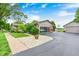 Charming home exterior with brick accents, well-maintained landscaping, and a spacious driveway at 333 N Windswept Rd, Greenfield, IN 46140