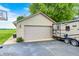 Detached two-car garage with RV parking next to a neatly landscaped lawn at 333 N Windswept Rd, Greenfield, IN 46140
