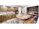 Well-equipped kitchen with natural wood cabinetry and a cozy breakfast nook with seating at 333 N Windswept Rd, Greenfield, IN 46140