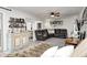 Open-concept living area with comfortable seating, a ceiling fan, and stylish decor at 333 N Windswept Rd, Greenfield, IN 46140