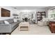 Comfortable living room with a cozy sofa, area rug, and view into the dining area at 333 N Windswept Rd, Greenfield, IN 46140
