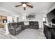 Cozy living area with plush seating, a ceiling fan, and an open layout, ideal for relaxation at 333 N Windswept Rd, Greenfield, IN 46140