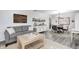 Open-concept living area with a comfortable sofa and view into the dining space at 333 N Windswept Rd, Greenfield, IN 46140