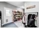 Organized mud room showcasing neat shelves, a clothing rack, and direct access from a back door at 333 N Windswept Rd, Greenfield, IN 46140