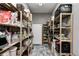 Well-stocked pantry with floor-to-ceiling shelves, neatly organized items, and durable flooring at 333 N Windswept Rd, Greenfield, IN 46140