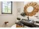Charming powder room features a vessel sink, wood accents, and a decorative mirror at 3675 Dartmoor Way, Zionsville, IN 46077