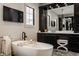 Serene bathroom boasts a freestanding tub, dark wood cabinets, and a sleek, modern design at 3675 Dartmoor Way, Zionsville, IN 46077