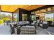 Entertain on this gorgeous covered patio with outdoor furniture and views of the backyard and neighborhood at 3675 Dartmoor Way, Zionsville, IN 46077