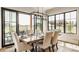 Dining room with hardwood floors, large windows and an outdoor view with seating area at 3675 Dartmoor Way, Zionsville, IN 46077