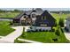 Beautiful home with a lush lawn and elegant curb appeal at 3675 Dartmoor Way, Zionsville, IN 46077