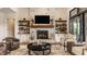 The living room has a stone fireplace and ample storage at 3675 Dartmoor Way, Zionsville, IN 46077