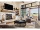 Bright, open living room with fireplace, large sliding glass doors and comfortable seating at 3675 Dartmoor Way, Zionsville, IN 46077