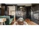 Stylish living room with dark built-in cabinets, fireplace, and plush green sofa at 3675 Dartmoor Way, Zionsville, IN 46077