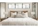 Stylish main bedroom features custom nightstands, soft pillows, and plenty of natural light at 3675 Dartmoor Way, Zionsville, IN 46077