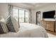Relaxing main bedroom with neutral tones, soft textures, and golf course views at 3675 Dartmoor Way, Zionsville, IN 46077