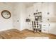 Bright home office boasts custom built-ins, hardwood floors, and stylish decor at 3675 Dartmoor Way, Zionsville, IN 46077