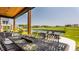 Dine outdoors with views of the community lake and golf course on this well appointed covered patio at 3675 Dartmoor Way, Zionsville, IN 46077