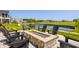 Beautiful patio with a stone fire pit and pond view at 3675 Dartmoor Way, Zionsville, IN 46077