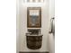Charming powder room features a unique barrel sink, decorative mirror, and stylish fixtures at 3675 Dartmoor Way, Zionsville, IN 46077