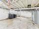 Spacious unfinished basement with a water heater and laundry machines, ready for customization at 4025 Main St, Anderson, IN 46013