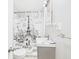 A small bathroom featuring a gray vanity and an Eiffel Tower shower curtain at 4025 Main St, Anderson, IN 46013