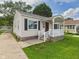 Charming house with a covered entryway and manicured lawn at 4025 Main St, Anderson, IN 46013