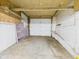 A clean, empty garage with an insulated door, ready for parking or projects at 4025 Main St, Anderson, IN 46013