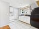Galley kitchen with white appliances and classic countertops at 4025 Main St, Anderson, IN 46013