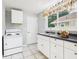 Bright kitchen with classic appliances and garden window at 4025 Main St, Anderson, IN 46013