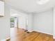 Bright and airy living room with hardwood floors and open doorway at 4025 Main St, Anderson, IN 46013