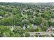 A beautiful aerial view showing a mix of homes surrounded by lush greenery in a quiet residential area at 409 N Sycamore St, Martinsville, IN 46151