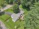 An aerial view of a well-maintained home with a spacious yard, patio area, and inviting curb appeal at 409 N Sycamore St, Martinsville, IN 46151