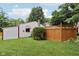 Spacious backyard featuring a well-kept lawn and a privacy fence for added seclusion and charm at 409 N Sycamore St, Martinsville, IN 46151