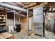 Unfinished basement with exposed ductwork, concrete walls and floor, housing the furnace and water heater at 409 N Sycamore St, Martinsville, IN 46151