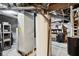 Basement view with water heater, HVAC, and utility infrastructure at 409 N Sycamore St, Martinsville, IN 46151