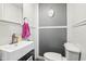 Modern half bath featuring gray wainscoting and white fixtures at 409 N Sycamore St, Martinsville, IN 46151
