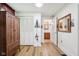 This bedroom offers wood flooring and easy access to an adjacent bathroom at 409 N Sycamore St, Martinsville, IN 46151