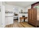 A secondary bedroom has hard flooring and access to an additional bedroom space at 409 N Sycamore St, Martinsville, IN 46151