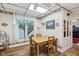 Cozy dining area featuring a wood table, chairs, and a large window for natural light at 409 N Sycamore St, Martinsville, IN 46151