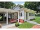 Cozy home featuring a covered porch with a swing, easy access ramp, and well-maintained landscaping at 409 N Sycamore St, Martinsville, IN 46151