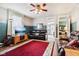 Inviting living room with decorative wallpaper, neutral carpet and multiple access points to other rooms at 409 N Sycamore St, Martinsville, IN 46151